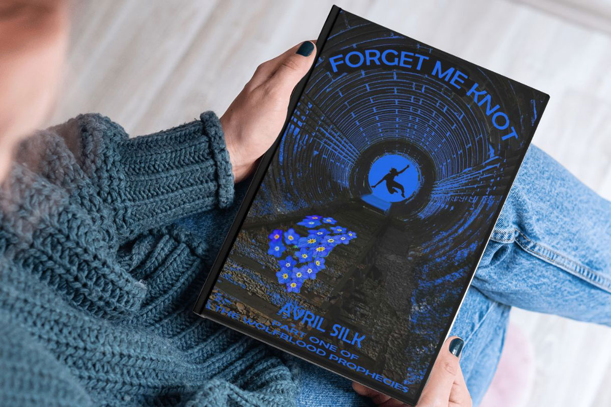 A photo of Forget me Knot book by Avril Silk being held in a lap
